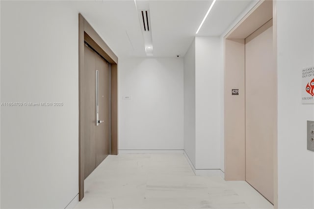 corridor featuring elevator