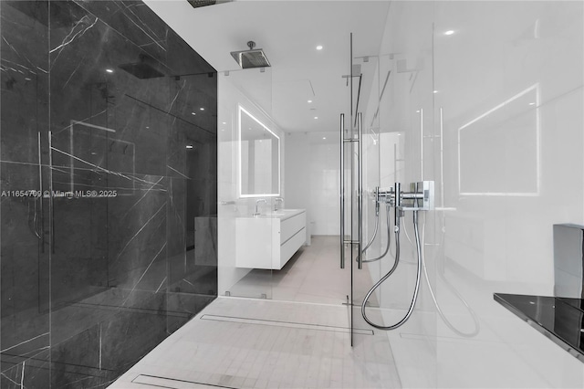 bathroom with tile patterned floors, vanity, and a shower