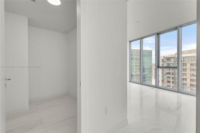 bathroom with floor to ceiling windows