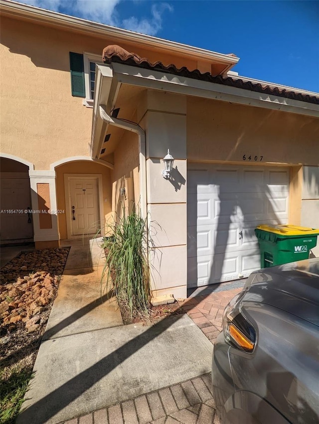 doorway to property with stucco siding