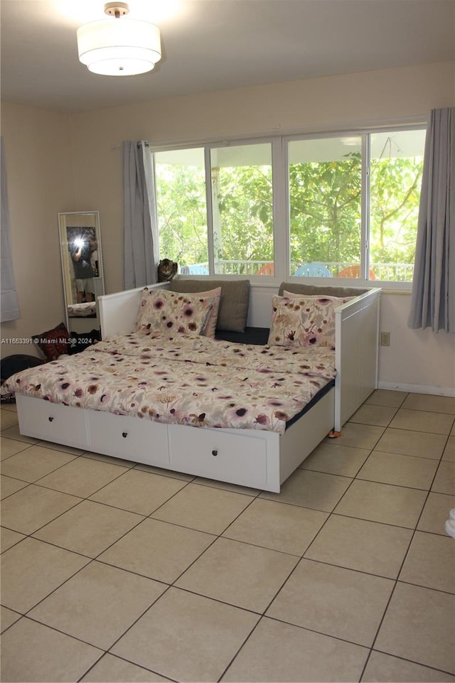 bedroom featuring light tile patterned flooring