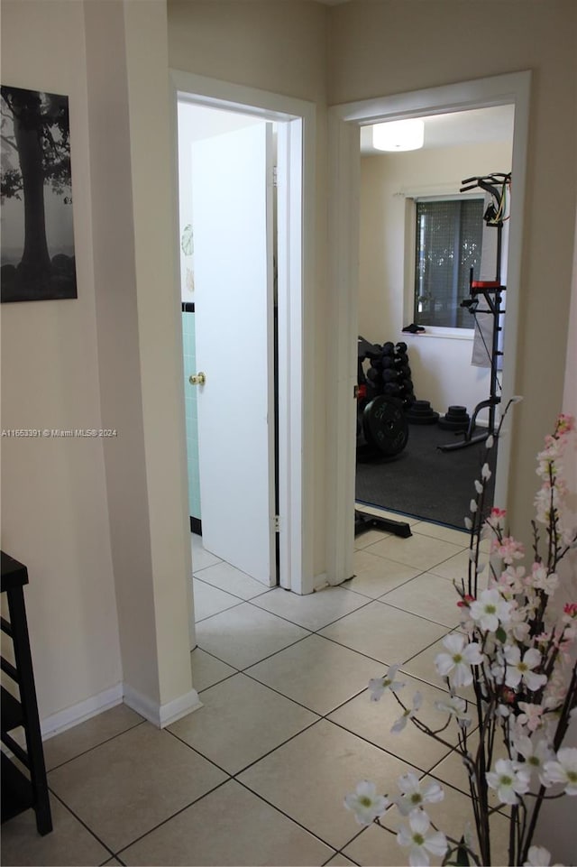 hall with light tile patterned flooring