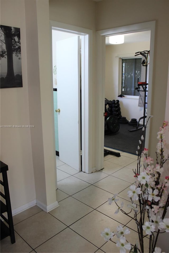 corridor featuring light tile patterned floors