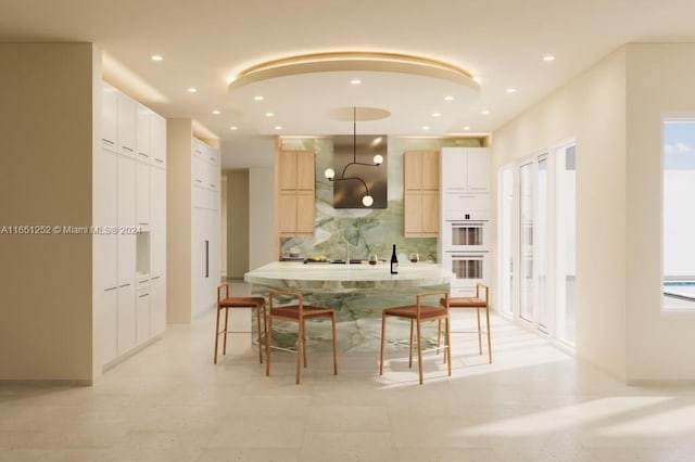 kitchen featuring backsplash, decorative light fixtures, extractor fan, and double oven