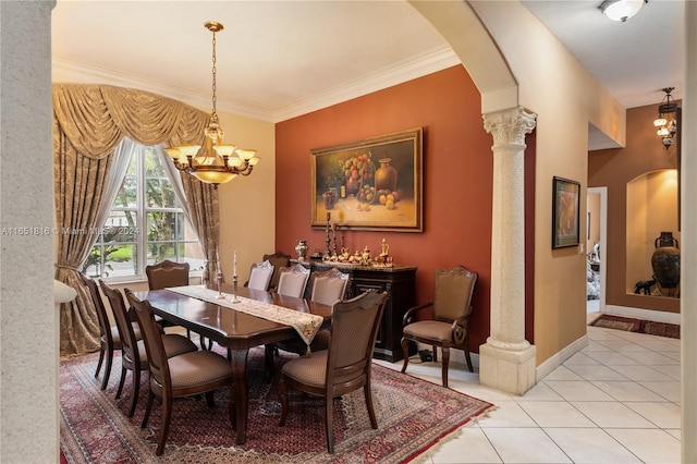 dining area with a notable chandelier, light tile patterned flooring, ornamental molding, and ornate columns