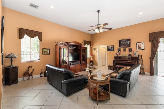 living room featuring light tile patterned floors and ceiling fan