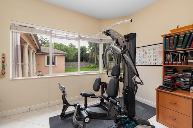 workout area with light tile patterned floors