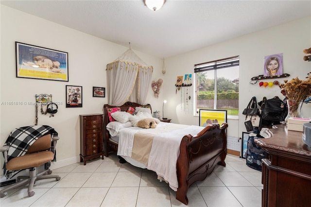 bedroom with light tile patterned floors