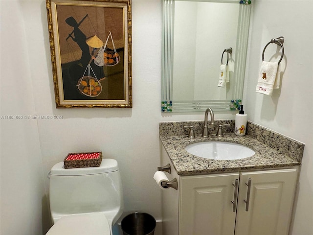 bathroom with vanity and toilet