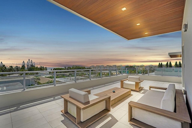 348 Desoto St, Hollywood, FL 33019 - patio terrace at dusk featuring an outdoor living space and a balcony