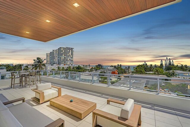 patio terrace at dusk with a balcony