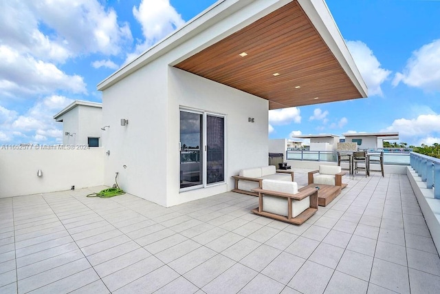 view of patio featuring a balcony