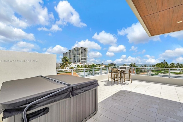 348 Desoto St, Hollywood, FL 33019 - view of patio featuring a city view, a hot tub, and a balcony