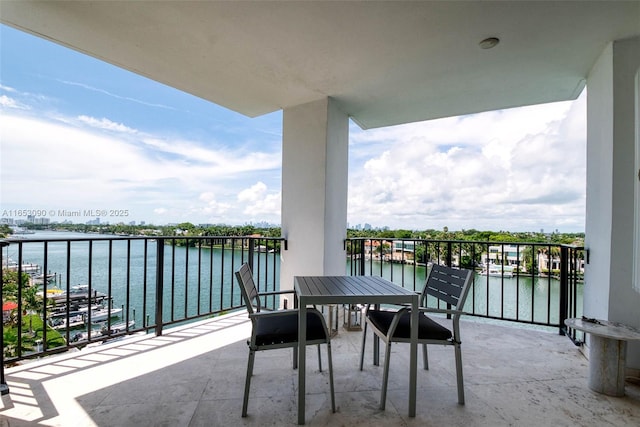 balcony featuring a water view