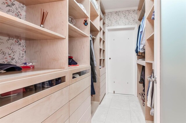 spacious closet featuring light tile patterned floors