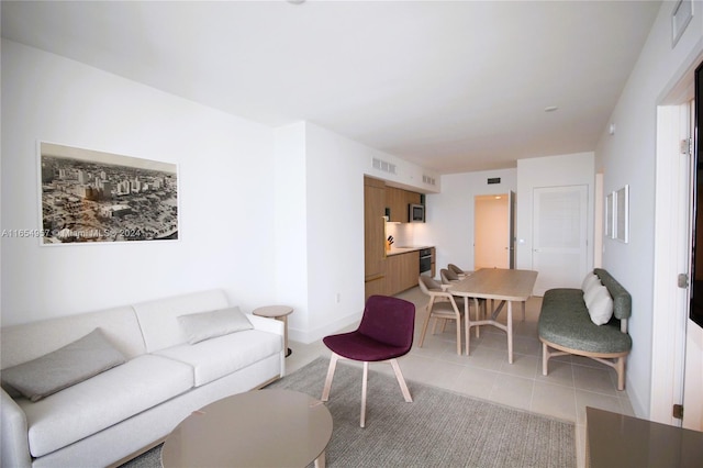 living room with light tile patterned floors