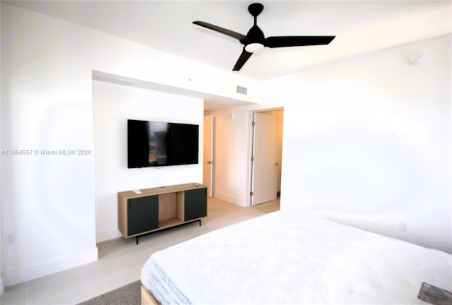 bedroom featuring light tile patterned flooring and ceiling fan