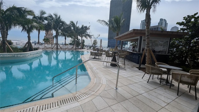 view of swimming pool featuring a patio area