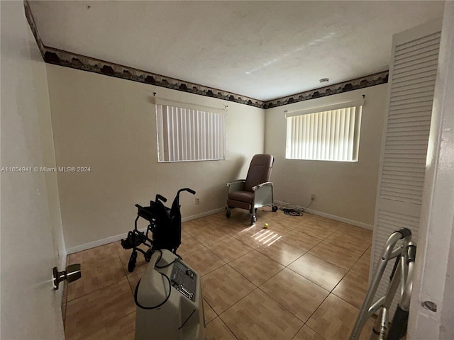 unfurnished room featuring tile patterned flooring