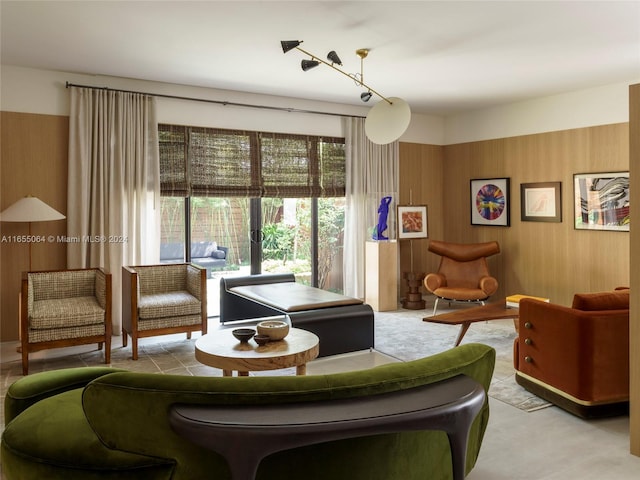 living room featuring wood walls