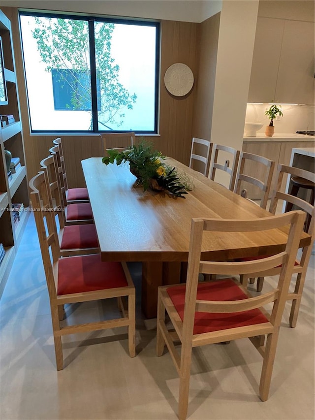 dining space with wooden walls