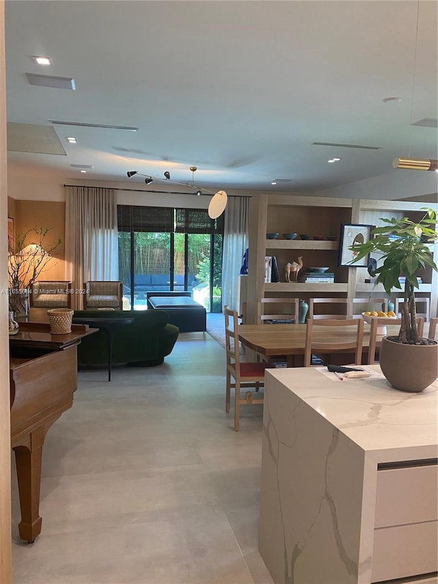 dining space with concrete floors