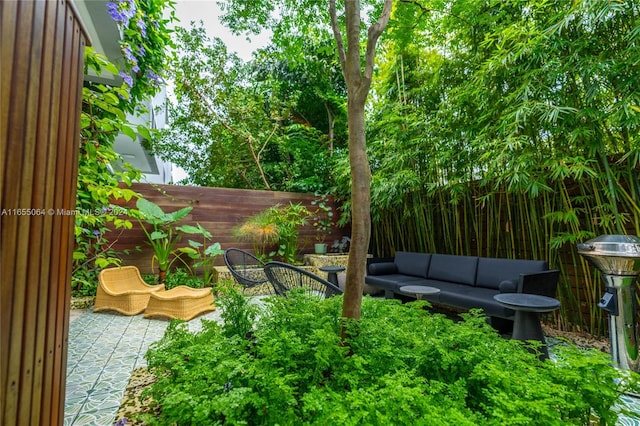 view of yard with outdoor lounge area and a patio area