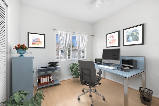 home office with ceiling fan and light hardwood / wood-style floors