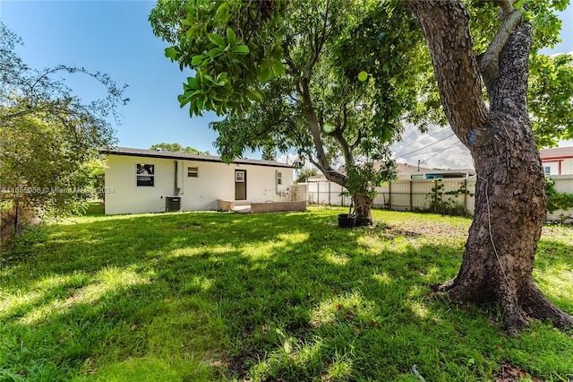 view of yard with central AC