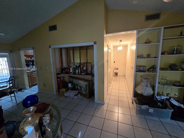 13915 SW 56th Ln Unit 13915, Miami, FL 33183 - living room with light tile patterned floors and high vaulted ceiling