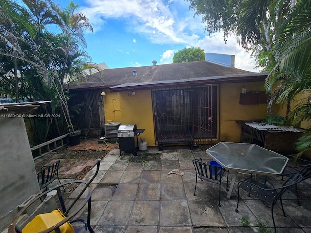 13915 SW 56th Ln Unit 13915, Miami, FL 33183 - view of patio with central air condition unit, area for grilling, and outdoor dining space