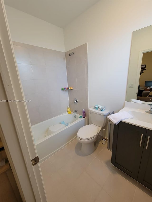 full bathroom featuring vanity, tile patterned floors, toilet, and bathtub / shower combination