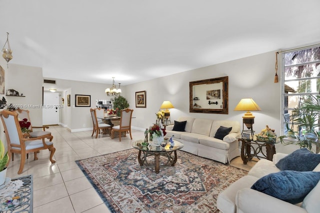 tiled living room with a notable chandelier