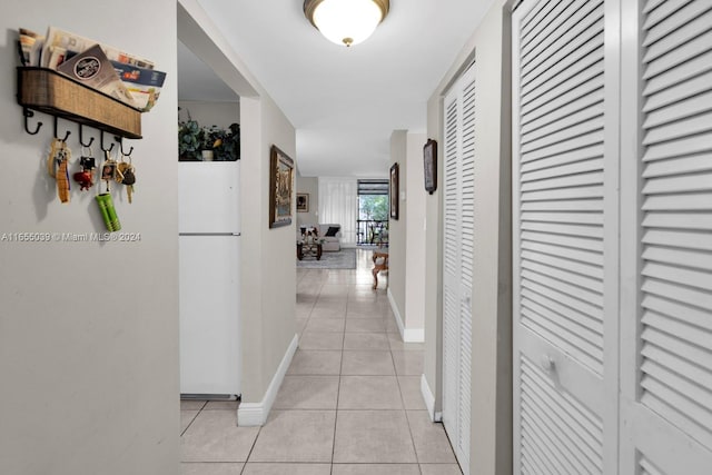 hallway featuring light tile patterned floors