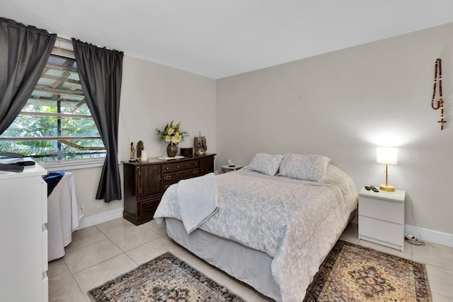 bedroom featuring light tile patterned flooring