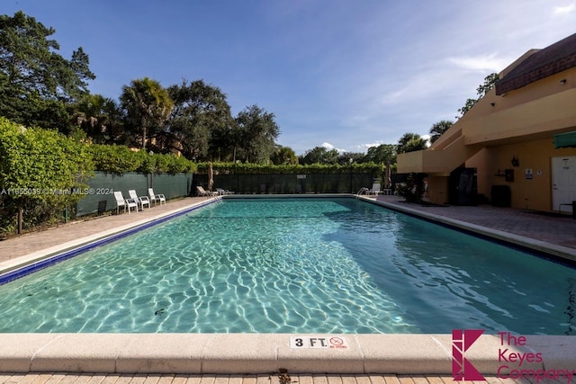 view of swimming pool featuring a patio area