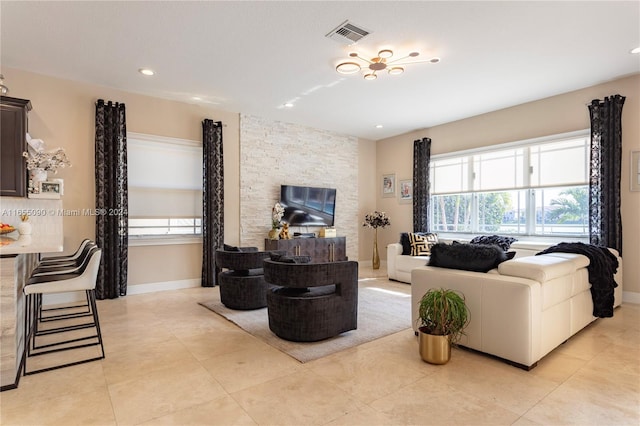 tiled living room featuring a fireplace