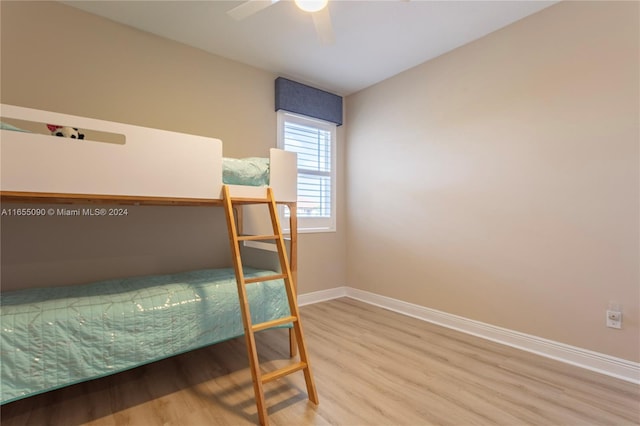 bedroom featuring hardwood / wood-style floors and ceiling fan