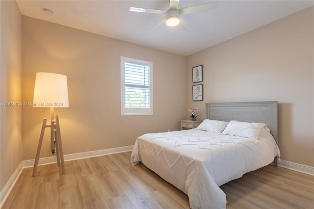 bedroom featuring light hardwood / wood-style flooring and ceiling fan