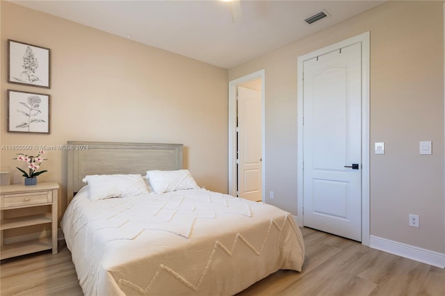 bedroom featuring light wood-type flooring and ceiling fan