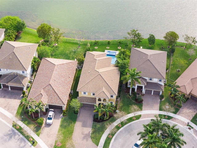 birds eye view of property with a water view