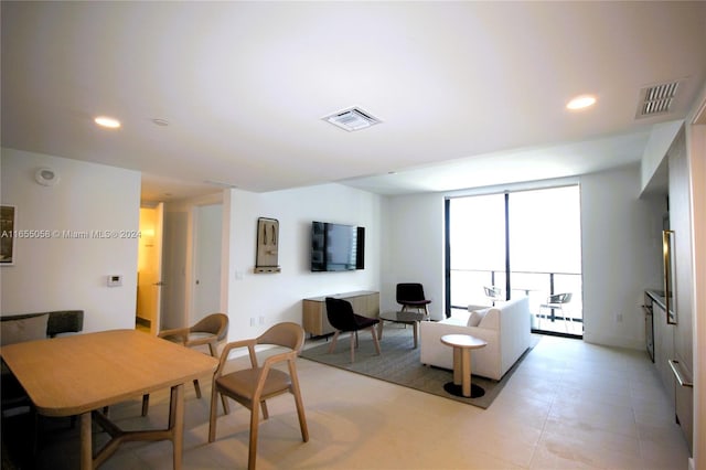 living room featuring floor to ceiling windows