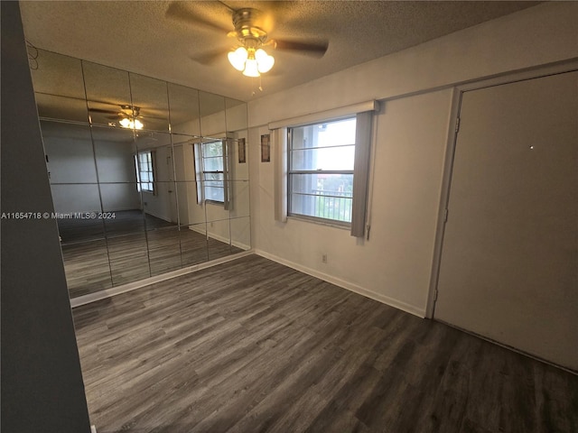 unfurnished bedroom featuring a textured ceiling, ceiling fan, and hardwood / wood-style floors