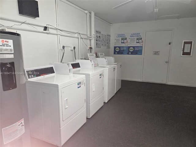 washroom featuring washing machine and dryer and electric water heater