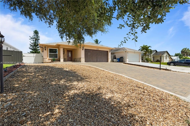 ranch-style house featuring a garage