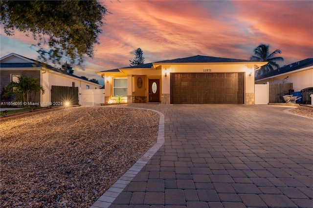 ranch-style house featuring a garage