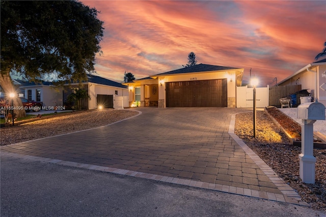 ranch-style home featuring a garage