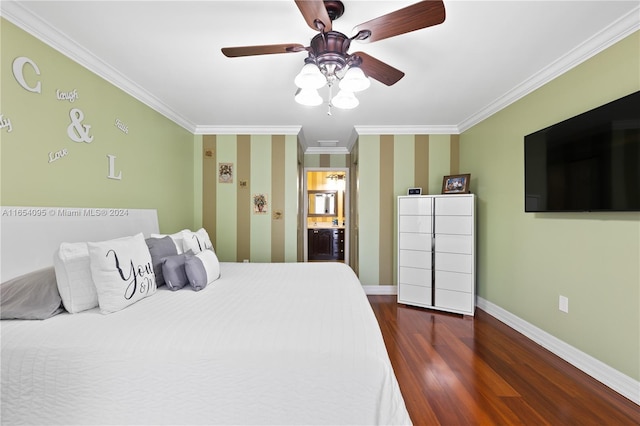 bedroom with dark hardwood / wood-style flooring, ceiling fan, ensuite bathroom, and crown molding