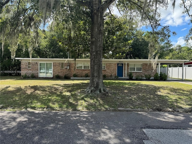 ranch-style home with a front yard