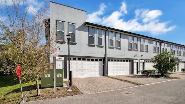 townhome / multi-family property featuring a garage